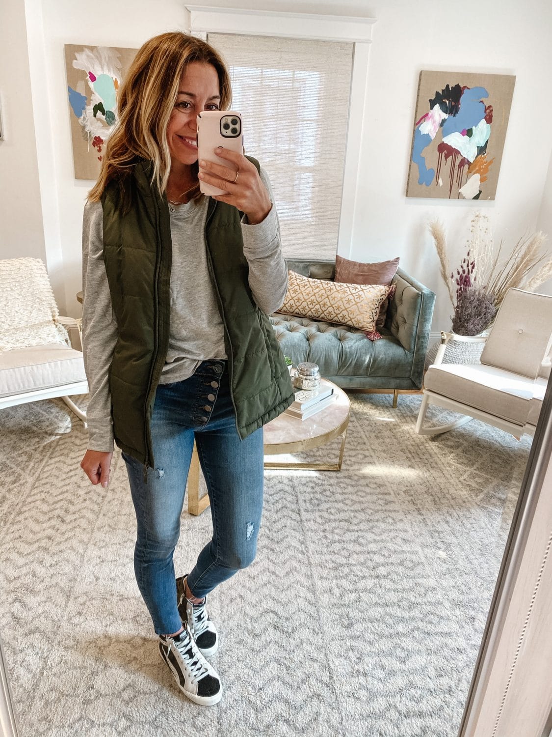 the motherchic wearing fall vest amazon vintage havana sneakers