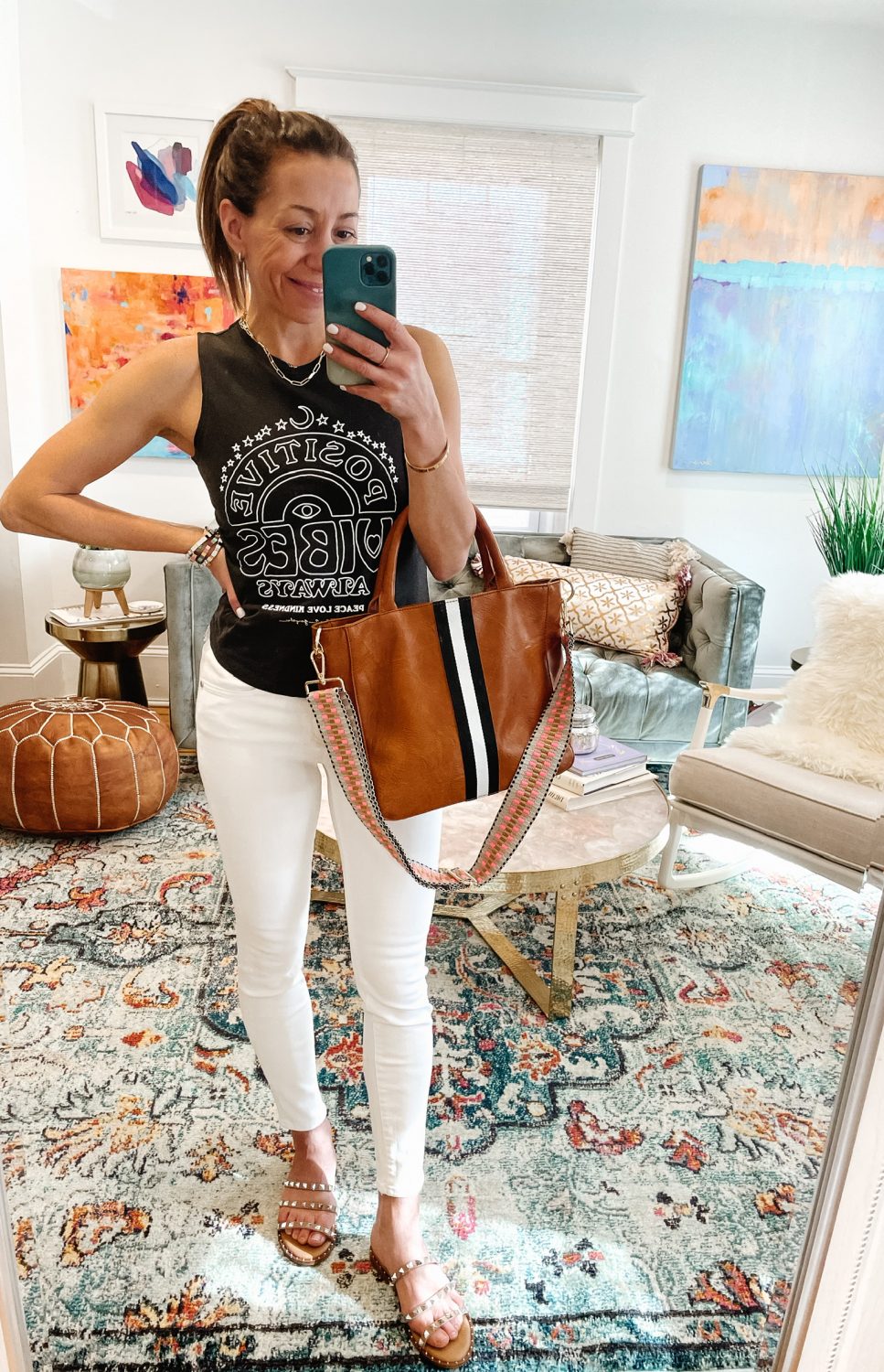 the motherchic wearing levis white jeans