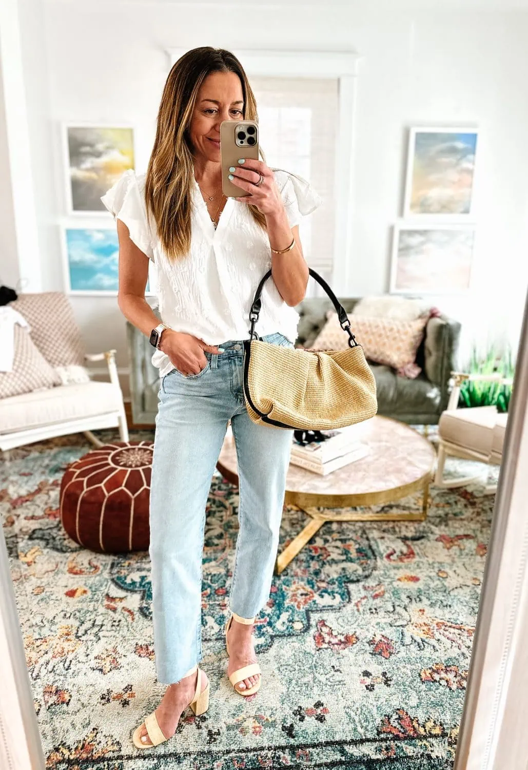 White t-shirt with print, light blue ripped boyfriend jeans, beige sandals,  textile striped bag on white wooden background. Overhead view of woman's  casual outfits. Flat lay, top view. Photos | Adobe Stock